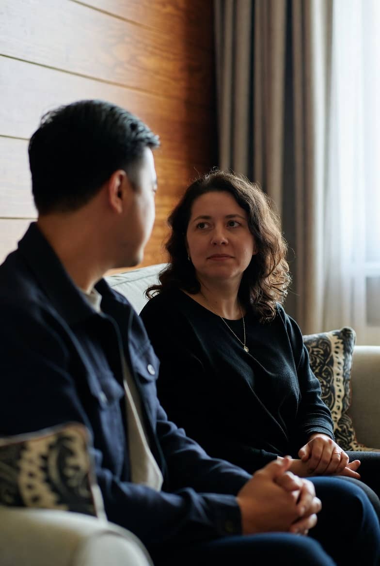 Couple in counselling session discussing affair recovery in Hampstead therapy room