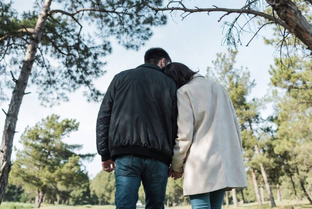 Couple walking together symbolising relationship healing after infidelity counselling