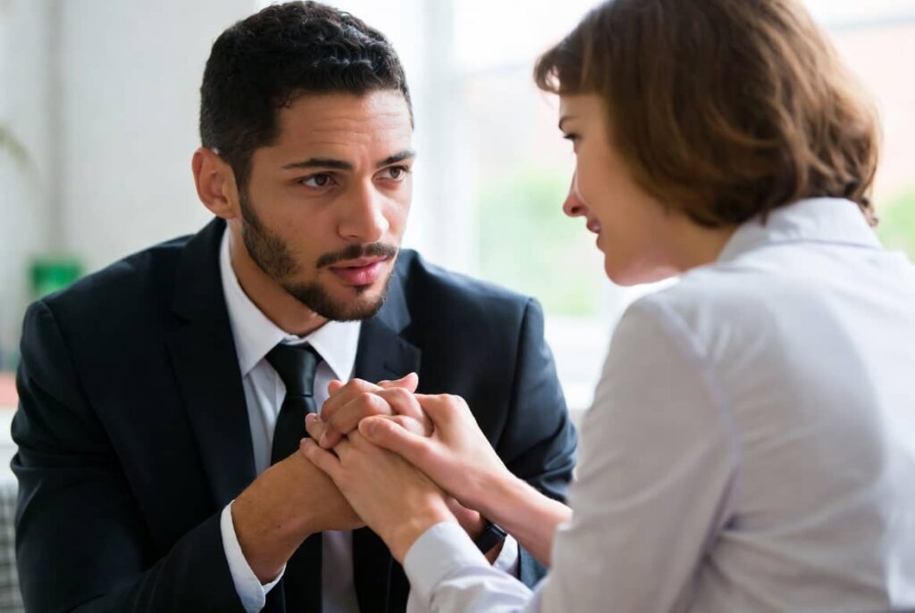 Couple having a supportive conversation during relationship counselling session in Hampstead